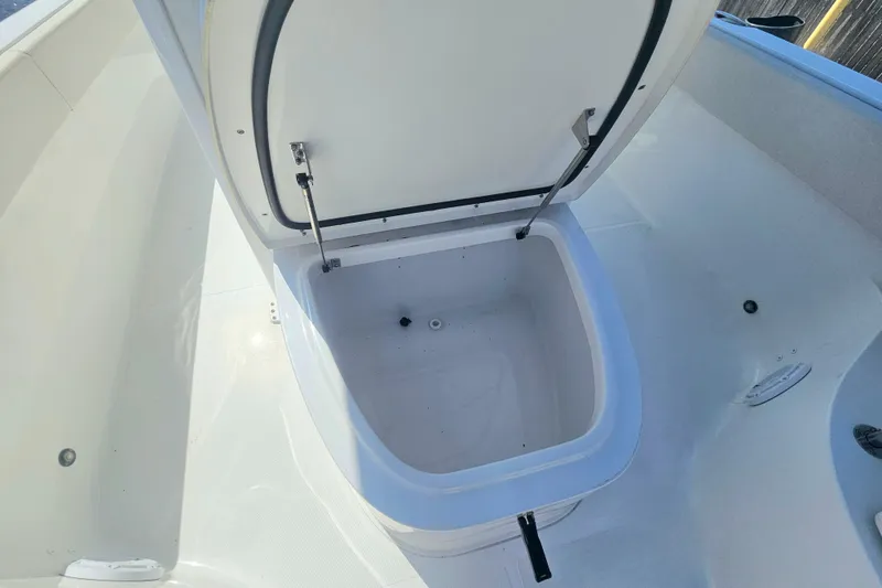 Slide: The Image of Open storage compartment on 2023 Sea Hunt Escape 28 boat. - 32