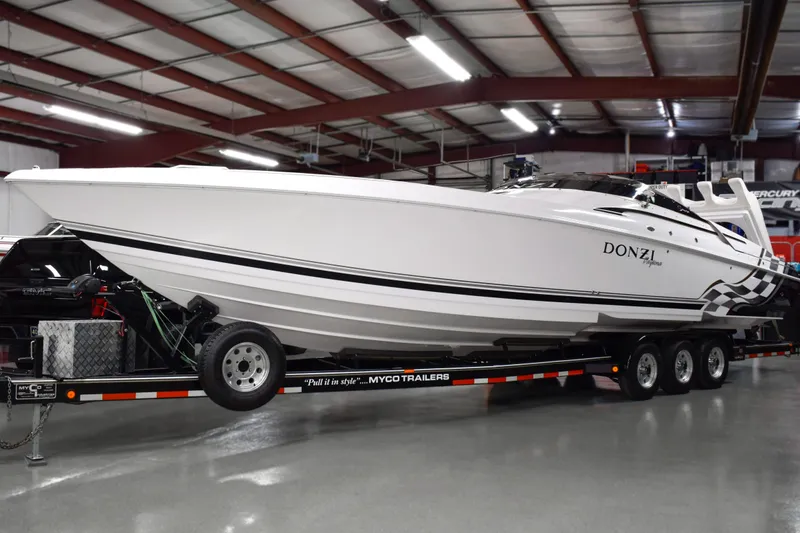 Slide: The Image of 2002 Donzi 38 ZX speedboat on trailer in indoor showroom. - 0