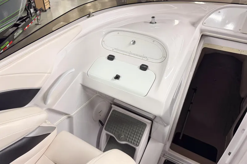 Slide: The Image of Interior view of a 2002 Donzi 38 ZX boat, featuring seating and cabin entrance. - 12
