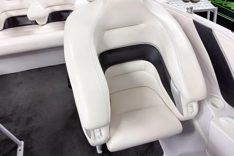 Slide: The Image of 2002 Donzi 38 ZX boat interior with white and black cushioned seating. - 15