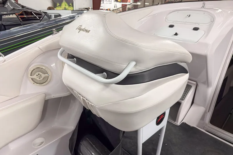 Slide: The Image of 2002 Donzi 38 ZX boat interior with white leather seating and speaker detail. - 16