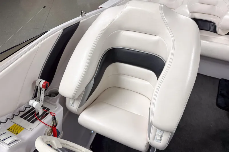 Slide: The Image of 2002 Donzi 38 ZX boat interior with white leather seat and control panel. - 17