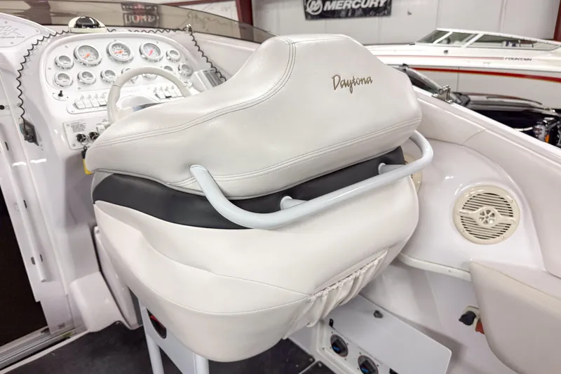 Slide: The Image of 2002 Donzi 38 ZX cockpit with white leather seating and dashboard controls. - 18