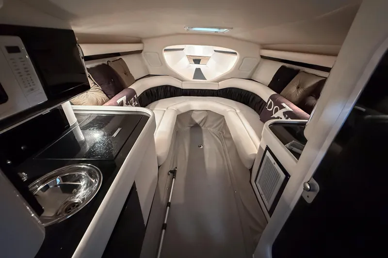 Slide: The Image of Interior of 2002 Donzi 38 ZX boat, featuring a cozy cabin with modern amenities. - 21