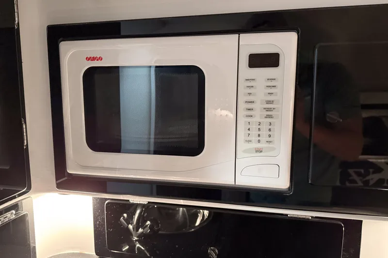 Slide: The Image of Built-in microwave in a 2002 Donzi 38 ZX boat kitchen area. - 28
