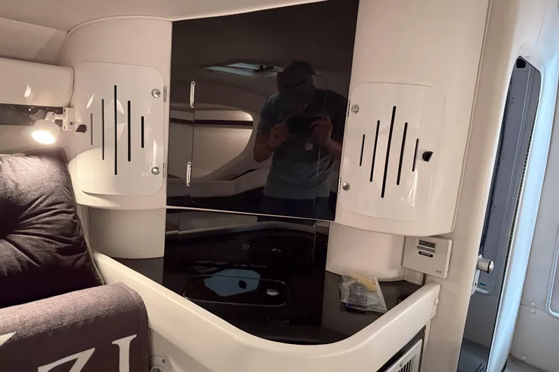 Slide: The Image of Interior of a 2002 Donzi 38 ZX boat featuring sleek cabinetry and modern design. - 29