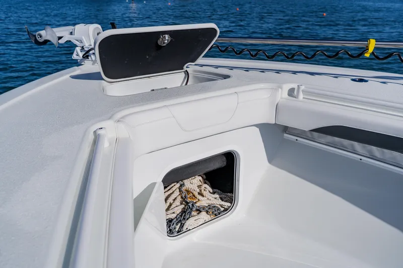 Slide: The Image of 2025 Yellowfin 36 Offshore boat deck with open storage compartment. - 10