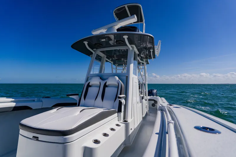 Slide: The Image of 2025 Yellowfin 36 Offshore boat on open sea under clear blue sky. - 16