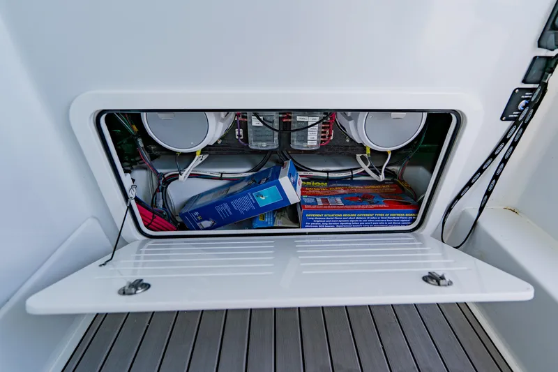 Slide: The Image of Storage compartment of 2025 Yellowfin 36 Offshore boat, showing equipment and wiring. - 20