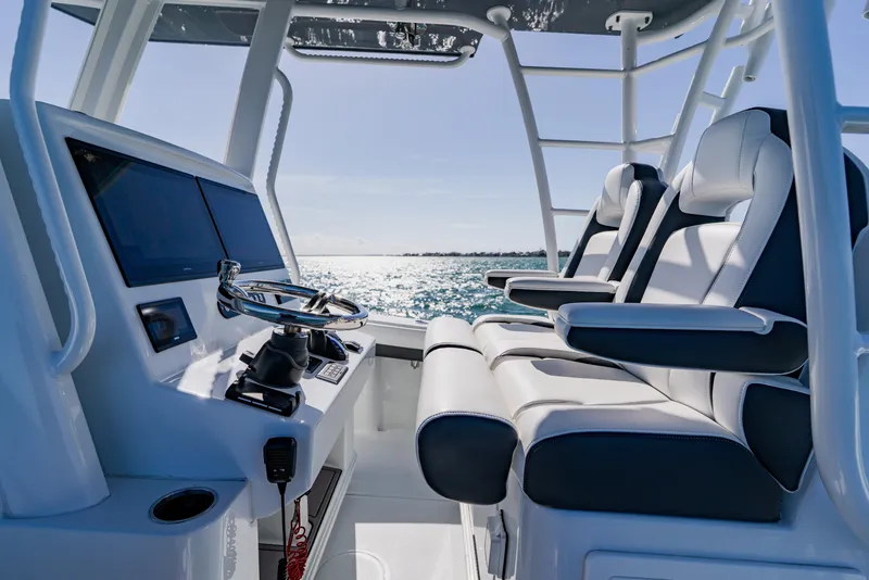 Slide: The Image of 2025 Yellowfin 36 Offshore boat interior with modern helm and seating. - 27