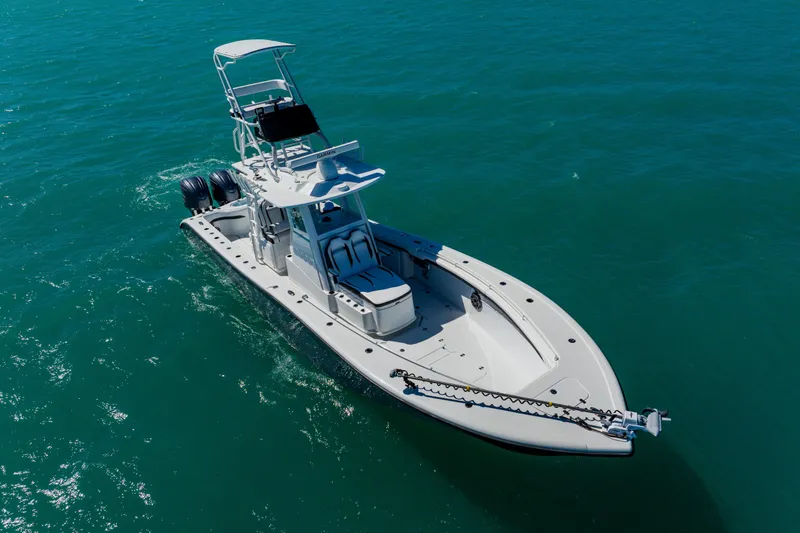 Slide: The Image of 2025 Yellowfin 36 Offshore boat cruising on clear blue water. - 3