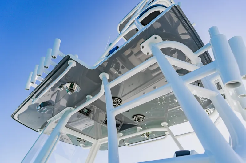 Slide: The Image of 2025 Yellowfin 36 Offshore boat structure against clear blue sky. - 31