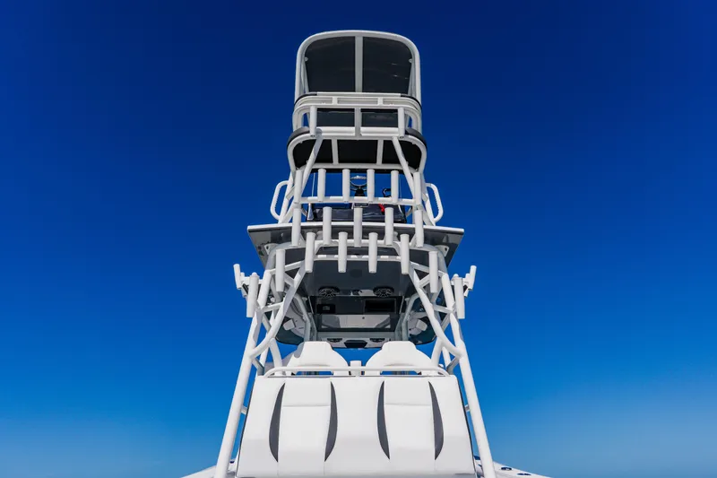 Slide: The Image of 2025 Yellowfin 36 Offshore boat tower against clear blue sky. - 38