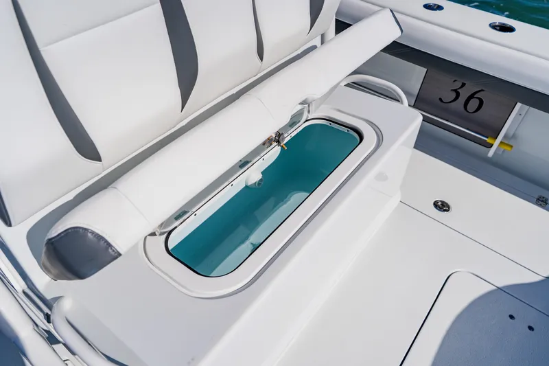 Slide: The Image of 2025 Yellowfin 36 Offshore boat interior with open storage compartment. - 40