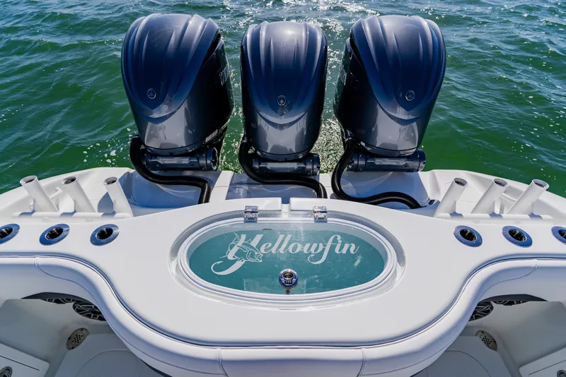 Slide: The Image of 2025 Yellowfin 36 Offshore boat with triple engines on open water. - 44