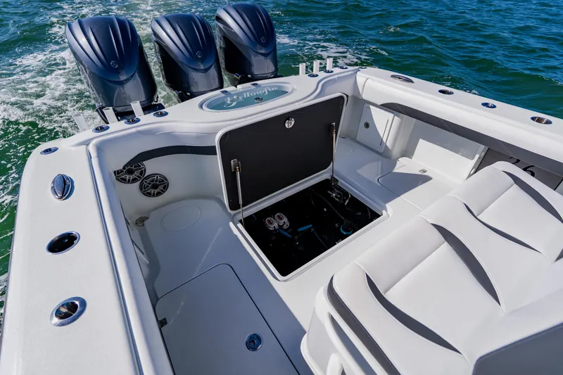 Slide: The Image of 2025 Yellowfin 36 Offshore boat with triple engines on open water. - 45