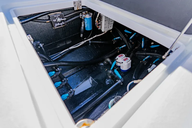 Slide: The Image of 2025 Yellowfin 36 Offshore boat interior showing wiring and plumbing components. - 47
