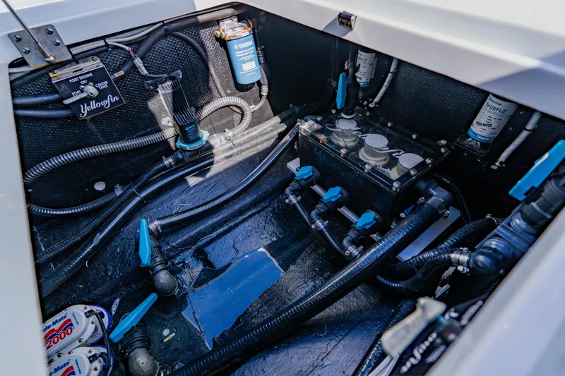 Slide: The Image of Engine compartment of 2025 Yellowfin 36 Offshore boat, showcasing wiring and components. - 49
