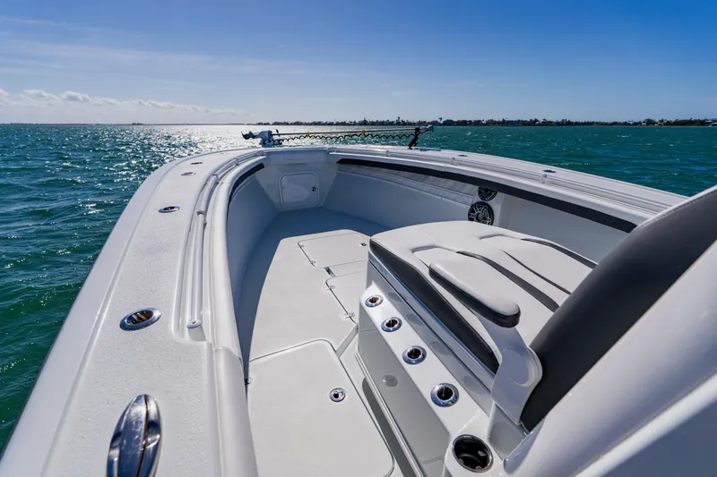 Slide: The Image of 2025 Yellowfin 36 Offshore boat on open water, showcasing sleek design and spacious deck. - 9
