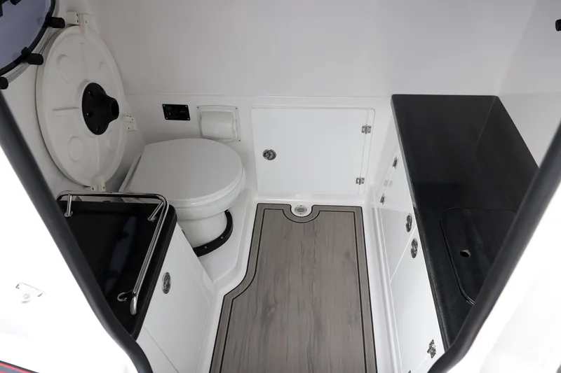 Slide: The Image of Modern bathroom interior of 2026 Monterey Elite 30 OB boat, featuring sleek design and amenities. - 1