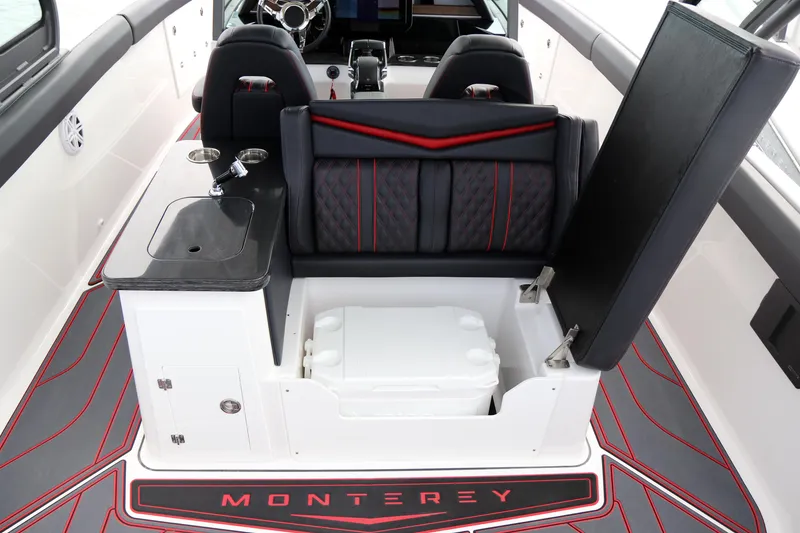 Slide: The Image of 2026 Monterey Elite 30 OB boat interior with seating, sink, and storage compartment. - 5