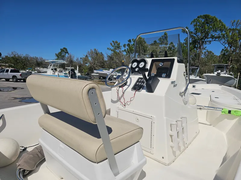 Slide: The Image of 2018 NauticStar 1810 NauticBay boat with console and seating. - 2