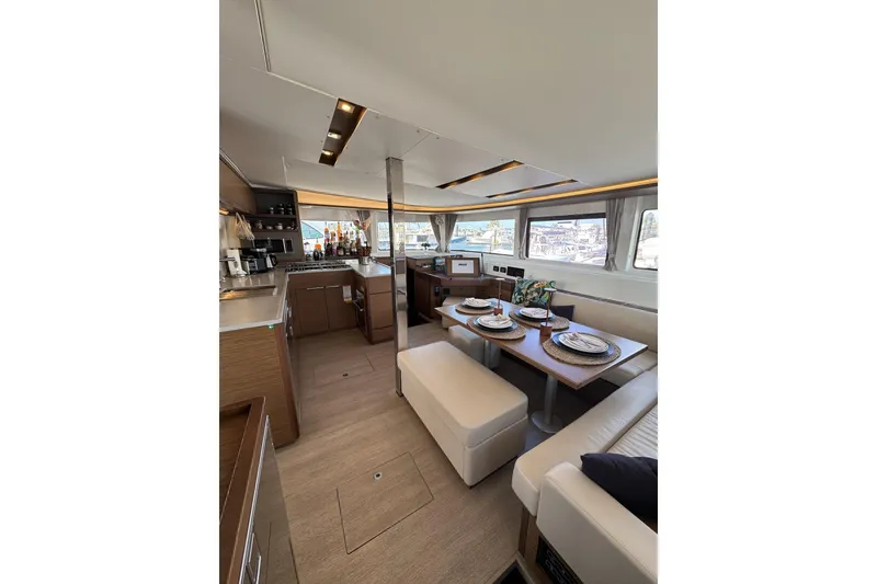Slide: The Image of Luxurious interior of 2020 Lagoon 46 yacht with dining area and modern kitchen. - 10