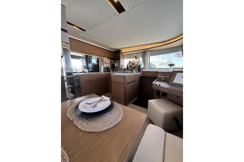 Slide: The Image of Luxurious interior of 2020 Lagoon 46 yacht with modern kitchen and dining area. - 15