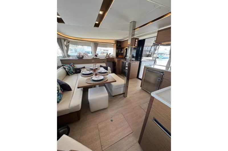 Slide: The Image of Luxurious interior of 2020 Lagoon 46 catamaran with elegant dining area and modern kitchen. - 16