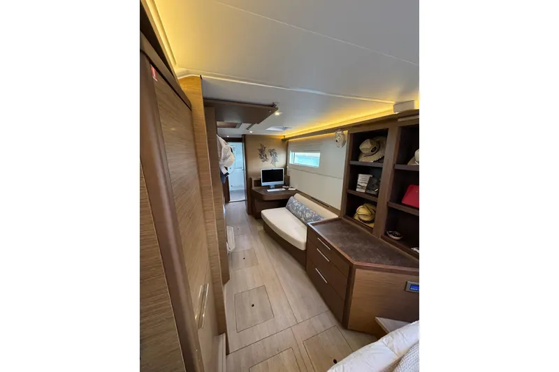 Slide: The Image of Interior of 2020 Lagoon 46 yacht with modern furnishings and ambient lighting. - 18