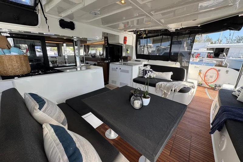 Slide: The Image of Luxurious interior of 2020 Lagoon 46 catamaran with modern seating and decor. - 2