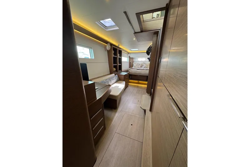 Slide: The Image of Luxurious interior of 2020 Lagoon 46 yacht with modern wood finish and ambient lighting. - 20