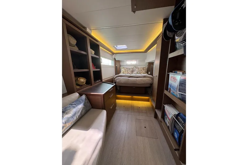 Slide: The Image of Luxurious interior of 2020 Lagoon 46 yacht with cozy bed and elegant wood finishes. - 22