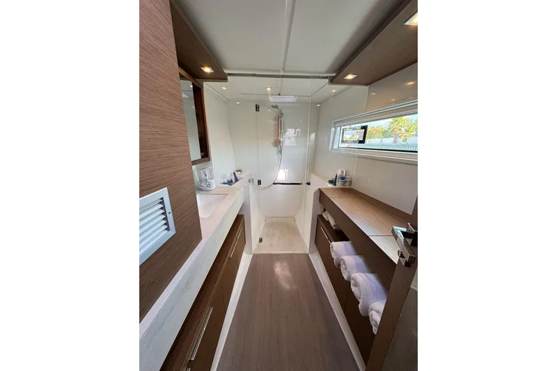 Slide: The Image of Luxurious bathroom interior of 2020 Lagoon 46 yacht with modern fixtures and wooden accents. - 23