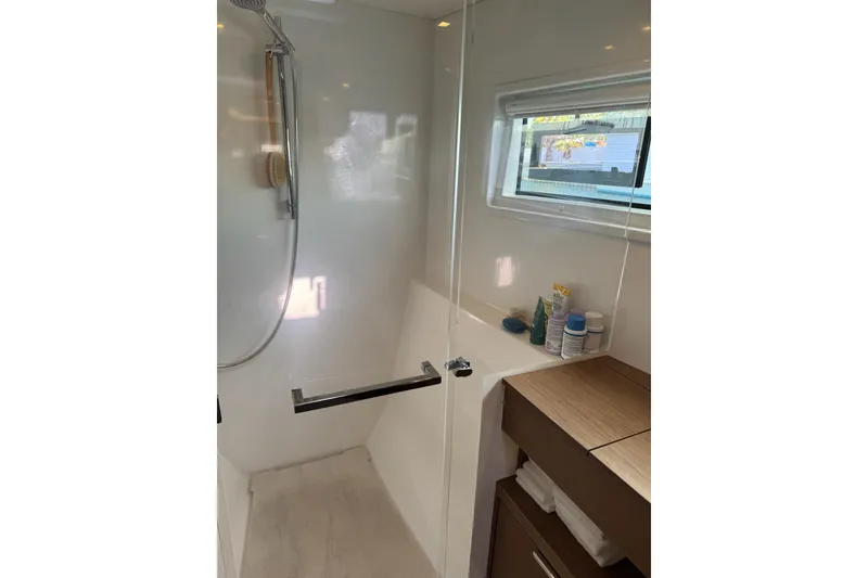 Slide: The Image of Modern bathroom in 2020 Lagoon 46 yacht with shower and storage. - 25