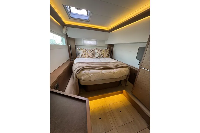 Slide: The Image of Luxurious cabin interior of 2020 Lagoon 46 yacht with cozy bed and ambient lighting. - 26