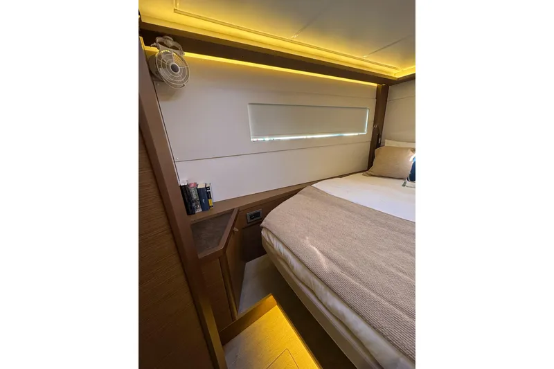 Slide: The Image of Luxurious cabin interior of 2020 Lagoon 46 yacht with cozy bed and ambient lighting. - 35