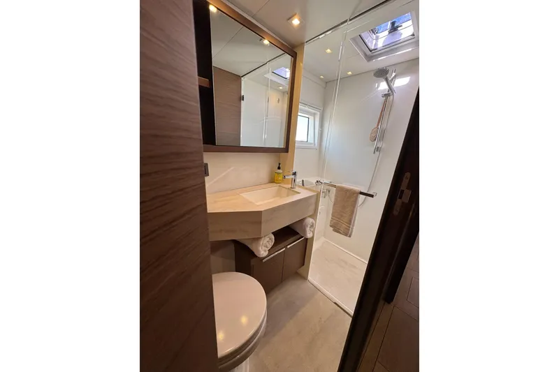 Slide: The Image of Modern bathroom in 2020 Lagoon 46 yacht with shower, sink, and skylight. - 37