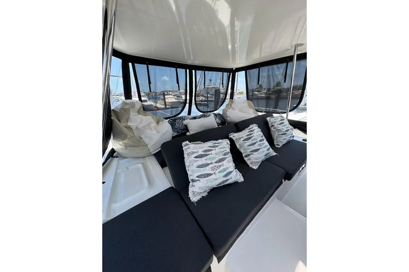 Slide: The Image of Interior of 2020 Lagoon 46 yacht with cozy seating and decorative pillows. - 62