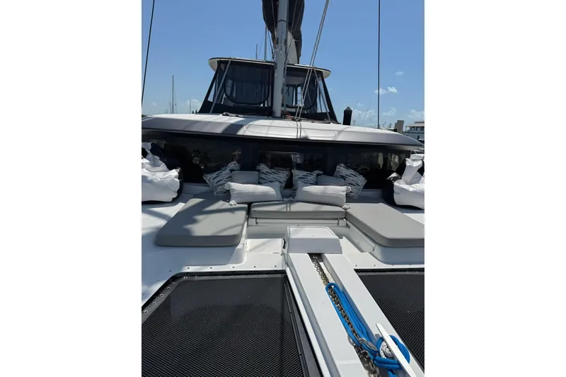 Slide: The Image of 2020 Lagoon 46 yacht with cushioned deck and sleek design. - 71