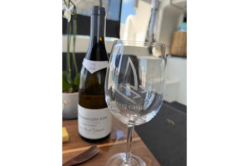 Slide: The Image of Wine glass and bottle on Lagoon 46 yacht, 2020 model, with elegant setting. - 72