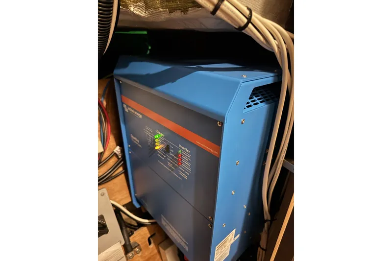 Slide: The Image of Electrical system in 2020 Lagoon 46 yacht, featuring a blue inverter with visible wiring. - 79