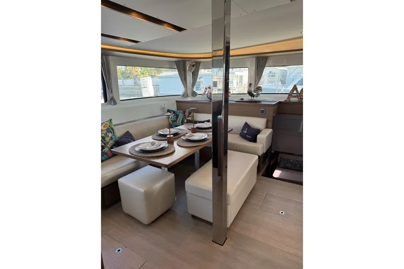 Slide: The Image of Luxurious interior of 2020 Lagoon 46 catamaran with elegant dining area and modern decor. - 9
