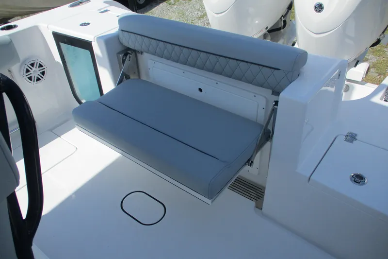Slide: The Image of 2026 Sportsman Open 252 Center Console boat with foldable seating and modern design. - 10