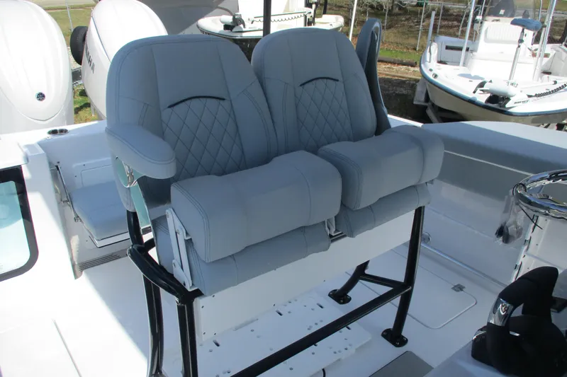 Slide: The Image of 2026 Sportsman Open 252 Center Console boat with dual cushioned seats. - 11