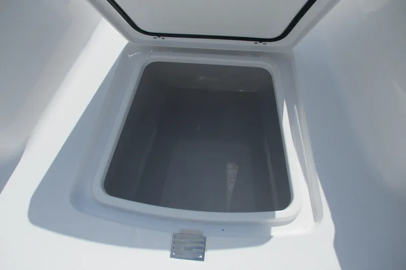 Slide: The Image of Open storage compartment on 2026 Sportsman Open 252 Center Console boat. - 13