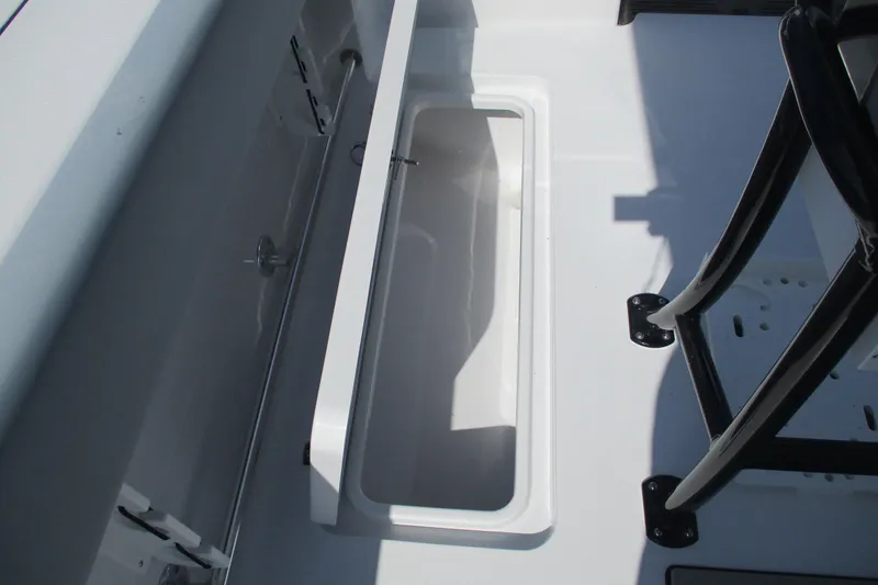 Slide: The Image of 2026 Sportsman Open 252 Center Console boat storage compartment detail. - 16