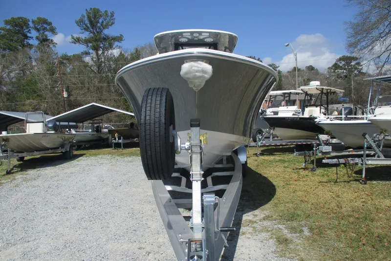Slide: The Image of 2026 Sportsman Open 252 Center Console boat on trailer, parked outdoors. - 2