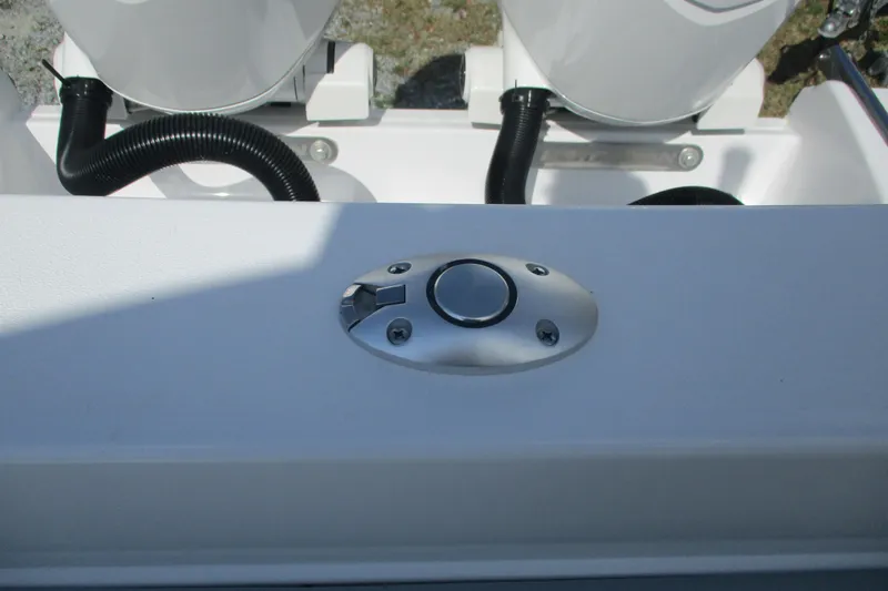 Slide: The Image of 2026 Sportsman Open 252 Center Console boat detail with control button and hoses. - 20