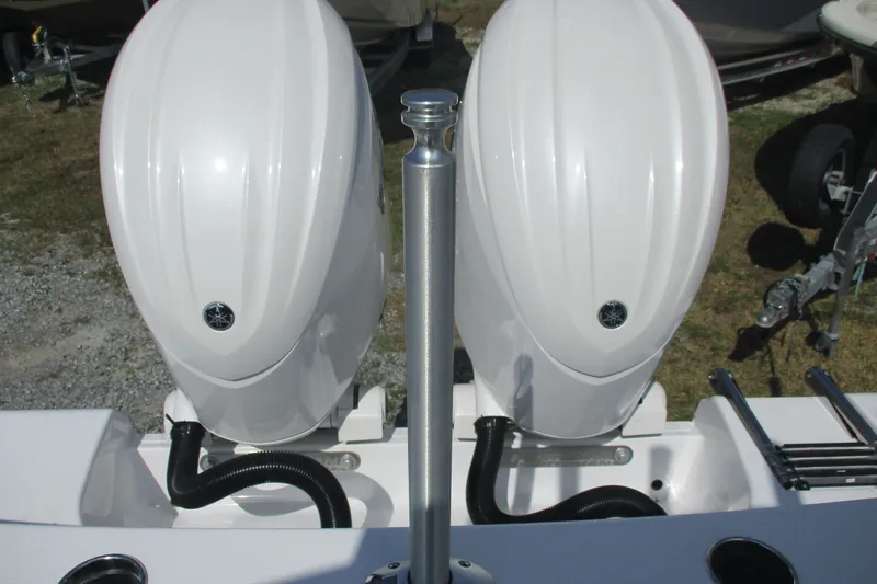 Slide: The Image of 2026 Sportsman Open 252 Center Console with dual outboard engines, rear view. - 21